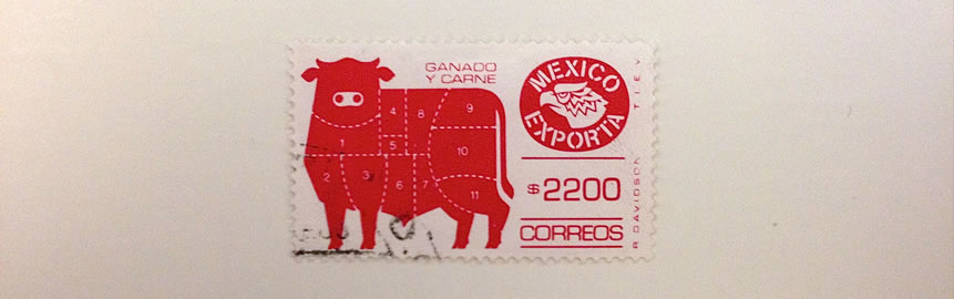 A photo of stamp with a picture of a cow on it